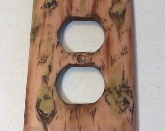 Bark of a tree light outlet, single, toggle cover: wood look switch plate