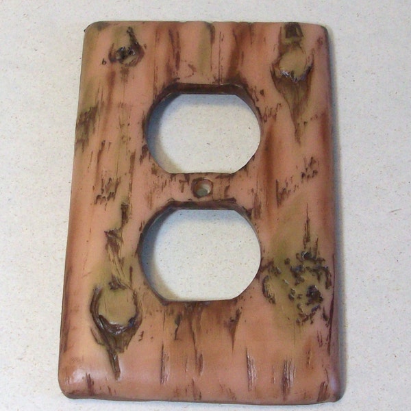 Bark of a tree light outlet, single, toggle cover: wood look switch plate