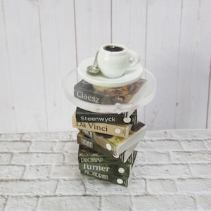 Miniature stack of Artist books as a side table with miniature coffee cup