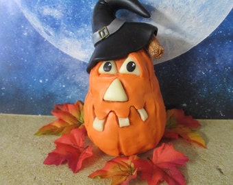 Pumpkin wearing a witch hat table top decoration