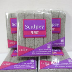 May include: Six packages of Sculpey Premo oven-bake clay, each package is 2 ounces (57 grams) and is gray in color. The packaging is clear plastic with a purple and pink label that says "Sculpey Premo" and "Premium Oven-Bake Clay".