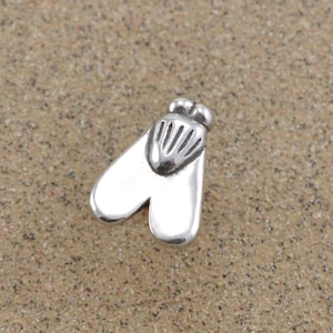 May include: A silver charm in the shape of a fly. The fly has a detailed head and wings.