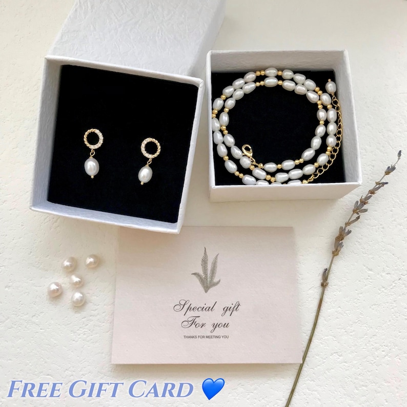 May include: White gift boxes with a pearl necklace and pearl earrings. A card with the text "Special gift for you" and "Thanks for meeting you".