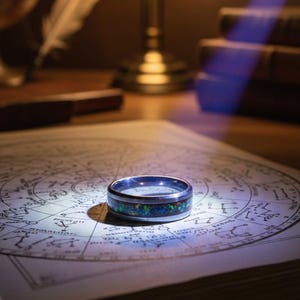 size 10 opal inlay with 24k gold flake inside a tungsten steel band