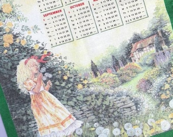 Vintage Tea Towel: 2000 Calendar, The People's Friend, girl blowing dandelion seeds in country cottage garden, retro calendar dish towel