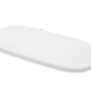 May include: White oval-shaped baby mattress with a zippered cover.