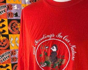 Vintage 80s Girl Scout Raccoon Tshirt – “Girl Scouting’s In Our Nature”