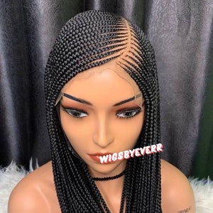 May include: A black braided wig with a lace front. The wig is styled in a straight, long, and sleek style. The wig is on a mannequin head. The text "WIGSBYEVERR" is visible on the wig.