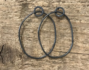 modern kinetic earrings - oxidised silver hoop earrings - unusual silver hoop studs - quirky black oval earrings