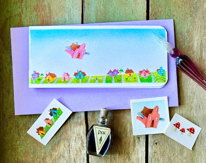 Flying Home Blank Slimline Card  | Matching Envelope and Stickers| House with Wings-Kitty-dog-trees-neighborhood- Valerie Walsh Cards
