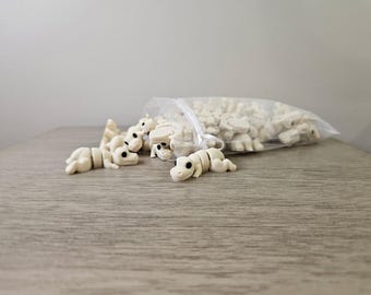 Mini T-Rex articulado blanco hueso