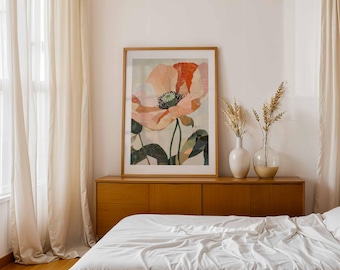 May include: A framed floral art print featuring a large, abstract poppy in shades of peach, coral, and green. The artwork is displayed above a wooden cabinet, with vases of dried plants and a bed with white linens in the foreground.