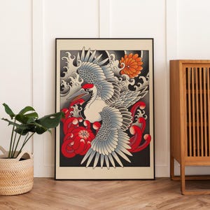 May include: A black and white crane with a red beak and red eyes is depicted in a traditional Japanese style with red and white flowers and blue waves. The crane is flying with its wings spread wide.