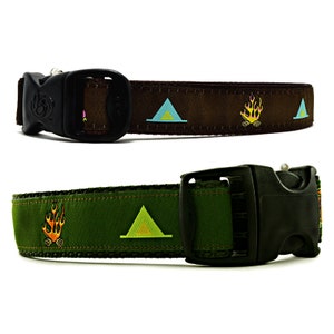 May include: Two dog collars with a camping theme. The top collar is brown with a repeating pattern of a tent and a campfire. The bottom collar is green with a repeating pattern of a tent and a campfire.