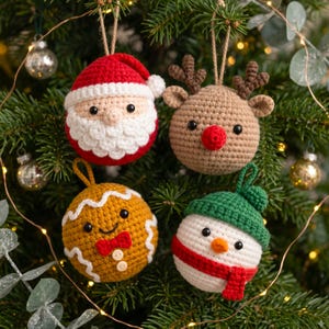 May include: Four round crochet ornaments featuring holiday characters: a red and white Santa Claus, a tan reindeer with brown antlers and a red nose, a golden-brown gingerbread person with white icing, and a white snowman with a green hat and red scarf.