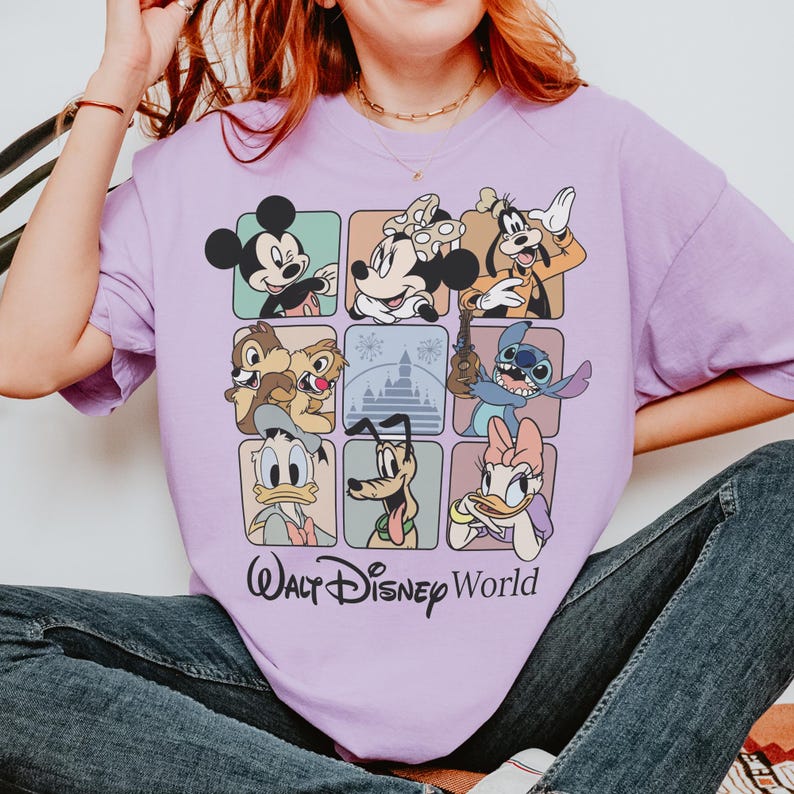 May include: A light purple t-shirt featuring a grid of Disney characters including Mickey Mouse, Minnie Mouse, Goofy, Chip and Dale, Stitch, Donald Duck, Pluto, and Daisy Duck. The words "Walt Disney World" are printed below the grid.