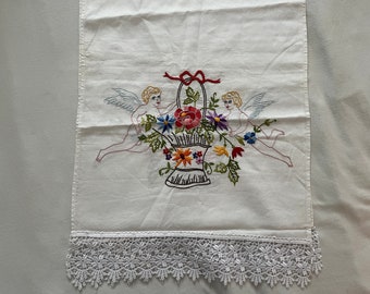 Hand-embroidered table runner with lace border (angel with flower basket)