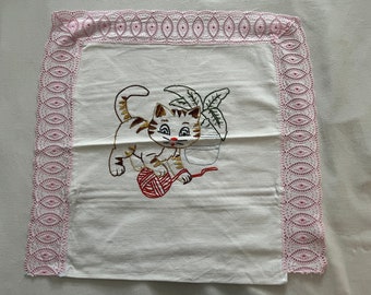 Hand-embroidered cushion cover with lace trim (cat with ball of yarn)