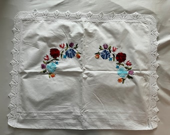Hand-embroidered cushion cover with crocheted lace border (blue flowers)