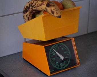 Retro mechanical kitchen scale, vintage orange kitchen decor from the 70s