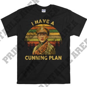 May include: Black t-shirt with a vintage-style graphic of a man in a military uniform. The graphic includes the text "I have a cunning plan".