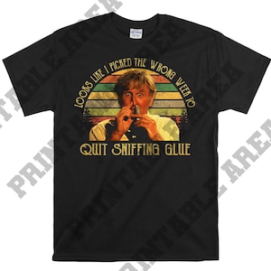 May include: A black t-shirt with a vintage-style graphic of a man with a mustache and the text "Looks like I picked the wrong week to quit sniffing glue."