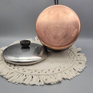 May include: A set of three ceramic mugs with a speckled, matte finish. Each mug features a different color: light blue, cream, and gray. The mugs have a simple, modern design and a comfortable handle.