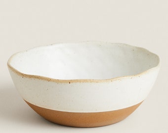 This salad bowl is the best for washing in the dishwasher, it is made of handmade ceramics and decorated with organic pottery.