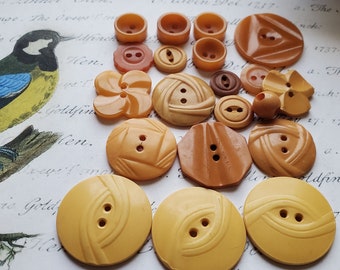 Twenty (20) Vintage BAKELITE or Casein Buttons. Orange, Yellow. Measure 1 1/8" and less. As found.