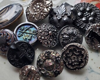 Thirteen (13) Lovely Vintage or Antique, Glass Buttons. Fancy Black Glass Buttons. Measure approx 1 1/8" and under.