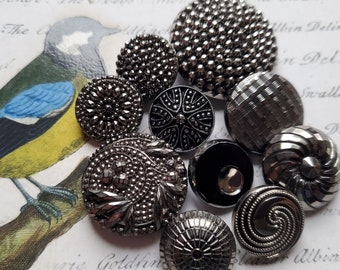 Ten (10) Lovely Vintage or Antique Carved, Silver Luster, Black Glass Buttons. Measure approx 1 1/4" and under.