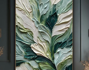 May include: Large abstract painting with a textured, three-dimensional effect. The artwork features a botanical design with layered brushstrokes in shades of white, green, and teal. The painting is framed in gold and hangs on a dark teal wall.