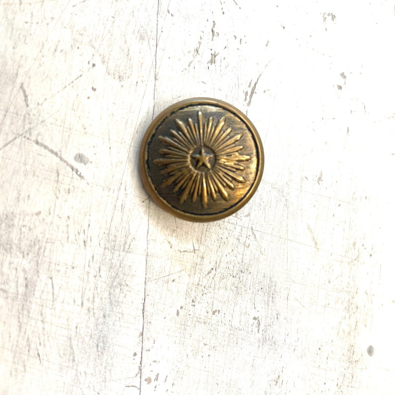 Vintage Metal Star Burst Domed Button Self-shank.