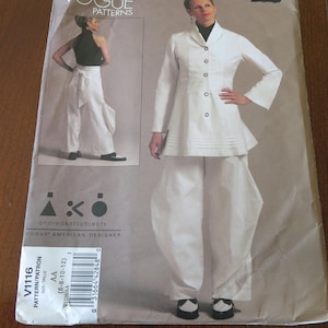 May include: Vogue pattern V1116 featuring a woman in a white outfit with a long-sleeved jacket and wide-leg pants. The pattern includes a smaller image of a different outfit. The text "Vogue Patterns" and "andreakatzobjects" are visible.