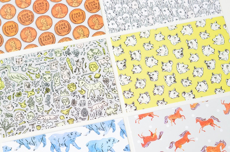 May include: Five different patterned cards with white borders. The top card features a repeating pattern of copper-colored US one-cent coins. The second card features a whimsical pattern of hand-drawn illustrations of animals, plants, and other objects. The third card features a repeating pattern of yellow bear faces. The fourth card features a repeating pattern of orange horses on a light gray background. The fifth card features a repeating pattern of blue bears on a white background.