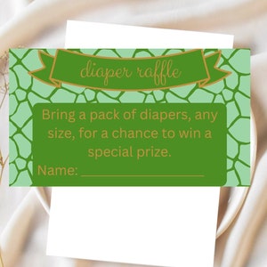 May include: Green and white diaper raffle ticket with a gold ribbon and the text "diaper raffle". The text "Bring a pack of diapers, any size, for a chance to win a special prize." is printed on the ticket. There is a blank line for a name.