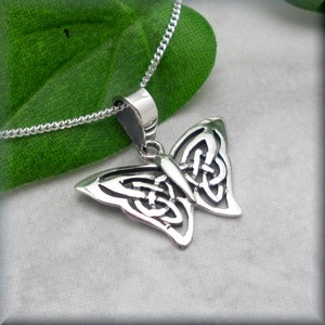 Small sterling silver butterfly with a Celtic knot design on it's wings.  Suspended from a sterling silver curb chain.  The butterfly pendant measures 1/2 inch long (1.3 cm) and 3/4" wide (1.9 cm) at the widest point of its wingspan.