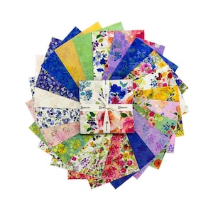 May include: A selection of floral fabric squares arranged in a circular pattern. The fabrics display diverse floral designs in shades of pink, blue, yellow, and green. A small stack of matching fabric squares is tied with a ribbon.