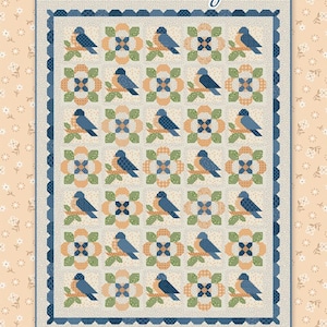 May include: A Birdsong quilt featuring a repeating pattern of blue birds perched on branches, alternating with floral designs in orange, green, and blue. The quilt has a scalloped blue border and is set against a cream background. The text "Birdsong" is at the top.