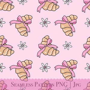 May include: A seamless pattern featuring pink and white illustrations of croissants tied with pink bows and white flowers on a pink background.