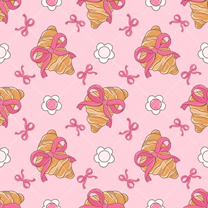 May include: A seamless pattern featuring pink bows and croissants on a pink background. The croissants are tied with pink bows and are surrounded by white flowers.