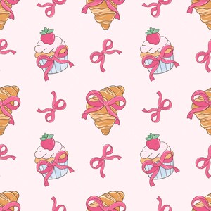 May include: A seamless pattern featuring pink bows, cupcakes with strawberries, and croissants. The background is a light pink color.