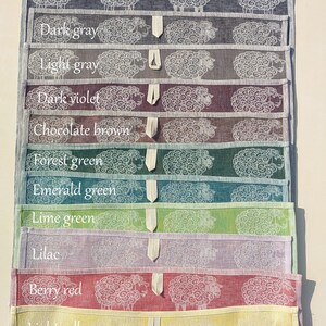 May include: A set of 11 tea towels featuring a sheep design in various colours, including dark blue, dark grey, light grey, dark violet, chocolate brown, forest green, emerald green, lime green, lilac, berry red, and light yellow.