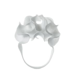 May include: White ceramic ring with a unique, organic, and textured design. The ring is made of a smooth, white ceramic and has a delicate, flowing shape.