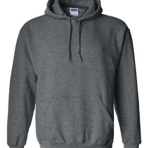 May include: A dark gray hooded sweatshirt with a front pocket and drawstring. The sweatshirt has a tag on the inside of the hood. The fabric appears to be a soft, comfortable material.