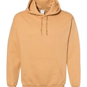 May include: A tan-colored hooded sweatshirt with a kangaroo pocket and drawstrings. The long-sleeved top has a relaxed fit and a ribbed hem and cuffs. The hoodie is made of a soft, comfortable material.