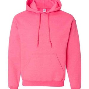 May include: A vibrant pink hooded sweatshirt with a drawstring hood and a kangaroo pocket. The sweatshirt is made of a soft material and is a solid color. The image is a close-up of the front of the sweatshirt.