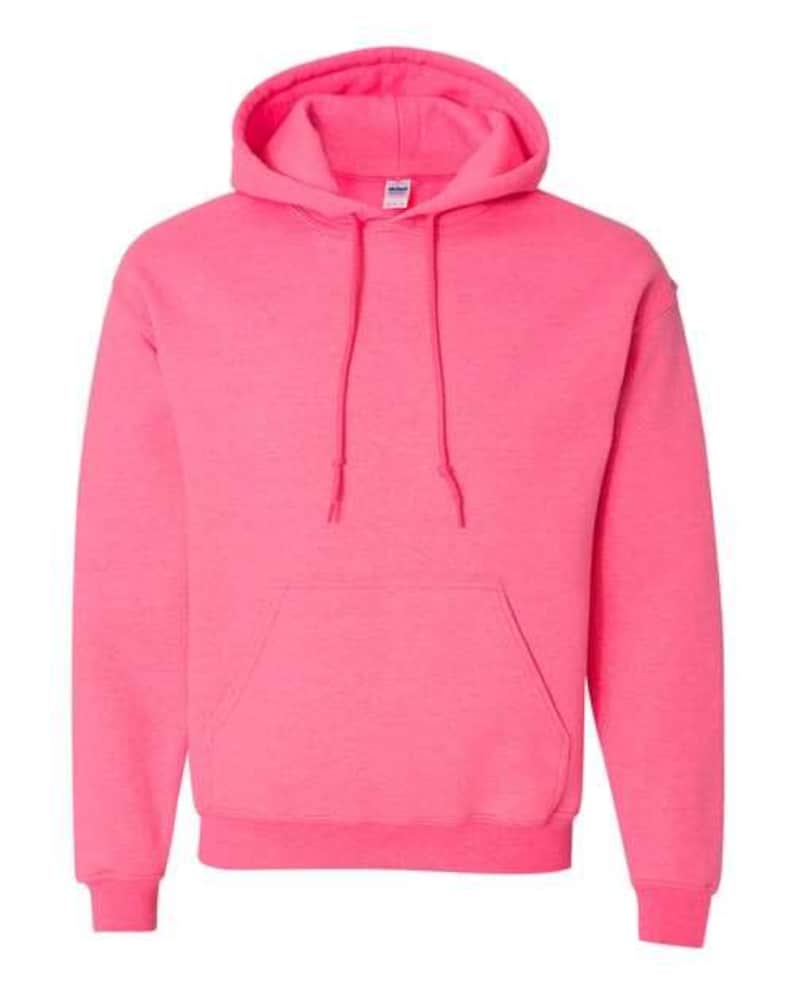 May include: A vibrant pink hooded sweatshirt with a drawstring hood and a kangaroo pocket. The sweatshirt is made of a soft material and is a solid color. The image is a close-up of the front of the sweatshirt.