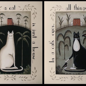 May include: Two framed illustrations with a cat theme. The first image shows a white cat sitting in front of a red house with the text "A home without a cat is just a house..." The second image shows a black and white cat sitting in front of a red house with the text "In a cat's eyes, all things belong to cats..."
