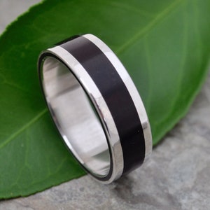 The Lados Black Coyol Wood Ring With features Bold Sterling Silver Edges